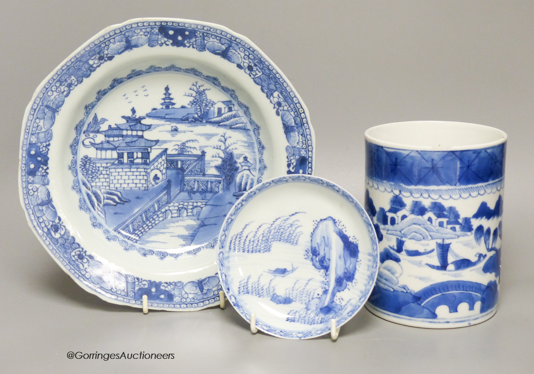 An 18th century Chinese blue and white mug, plate and saucer, largest 23cm diameter